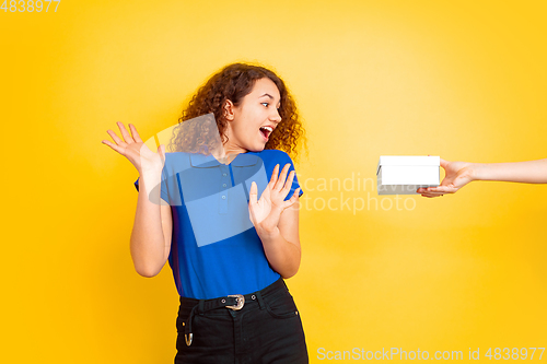 Image of Caucasian teen\'s girl portrait on yellow background