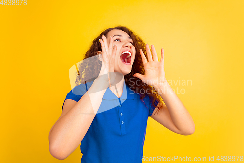 Image of Caucasian teen\'s girl portrait on yellow background