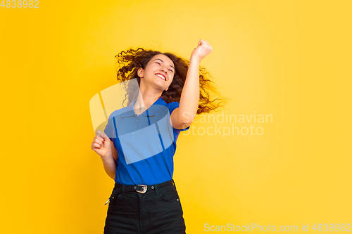 Image of Caucasian teen\'s girl portrait on yellow background