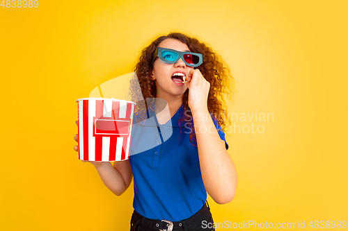 Image of Caucasian teen\'s girl portrait on yellow background