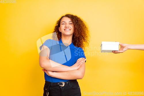 Image of Caucasian teen\'s girl portrait on yellow background