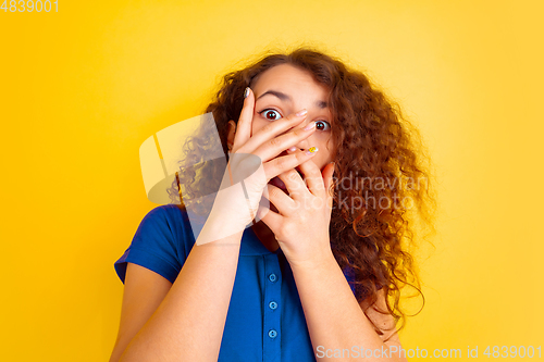 Image of Caucasian teen\'s girl portrait on yellow background