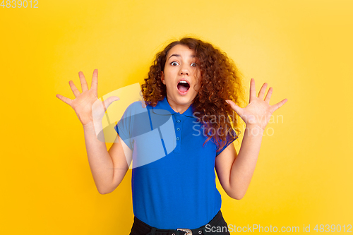 Image of Caucasian teen\'s girl portrait on yellow background