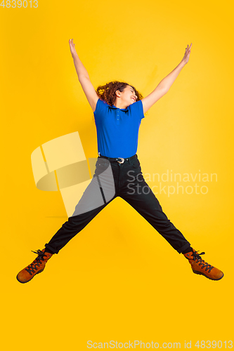Image of Caucasian teen\'s girl portrait on yellow background