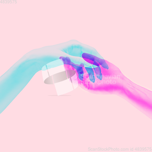 Image of Hands aesthetic on bright background, artwork. Concept of human relation, community, togetherness, symbolism, surrealism.