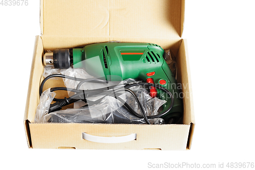 Image of Electric drill in a box.