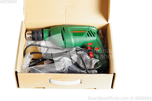 Image of Electric drill in a box.