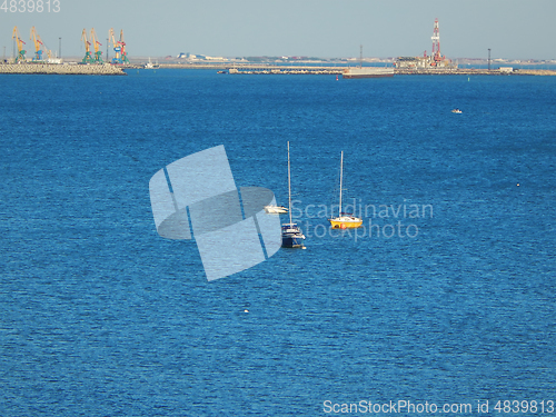 Image of Yachts and boat at sea.