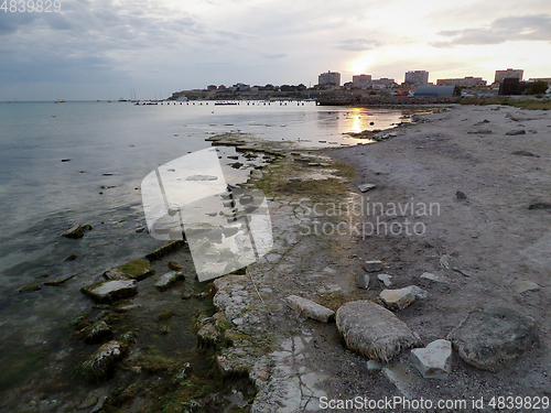 Image of Rocky seashore at sunset.