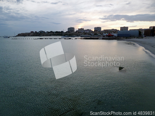 Image of Rocky seashore at sunset.