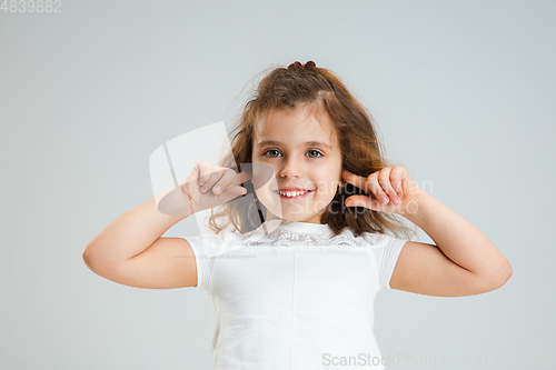 Image of Pretty caucasian girl portrait isolated on white studio background with copyspace