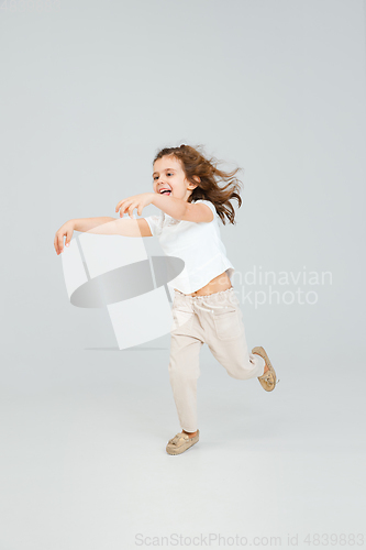 Image of Pretty caucasian girl portrait isolated on white studio background with copyspace