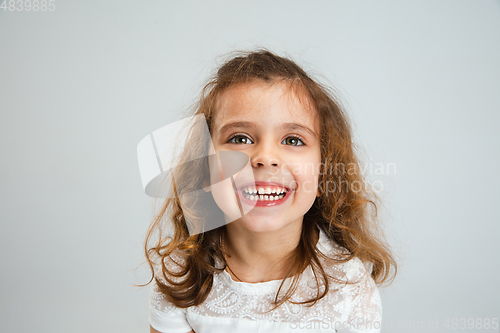 Image of Pretty caucasian girl portrait isolated on white studio background with copyspace