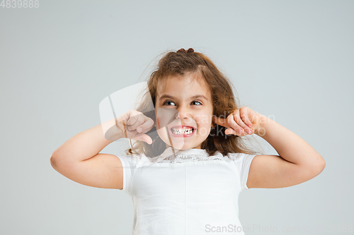 Image of Pretty caucasian girl portrait isolated on white studio background with copyspace