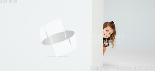 Image of Pretty caucasian girl portrait isolated on white studio background with copyspace