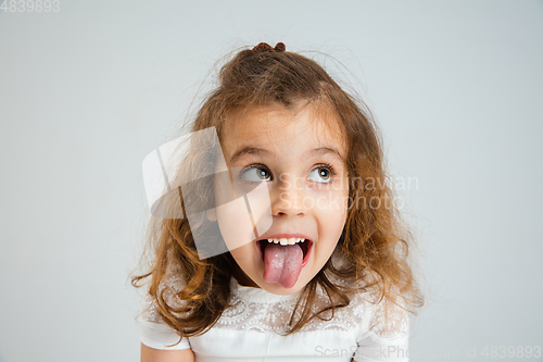 Image of Pretty caucasian girl portrait isolated on white studio background with copyspace