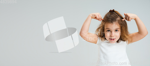 Image of Pretty caucasian girl portrait isolated on white studio background with copyspace