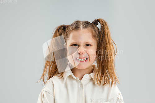 Image of Pretty caucasian girl portrait isolated on white studio background with copyspace