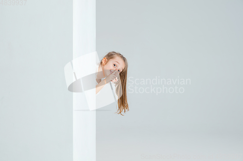 Image of Pretty caucasian girl portrait isolated on white studio background with copyspace