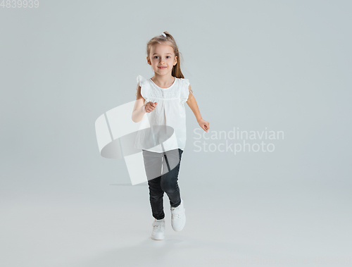Image of Pretty caucasian girl portrait isolated on white studio background with copyspace