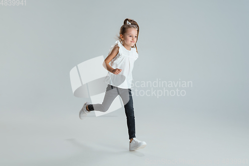 Image of Pretty caucasian girl portrait isolated on white studio background with copyspace