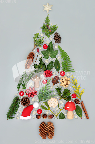 Image of Abstract Christmas Tree with Decorations and Winter Greenery 