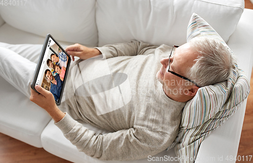 Image of senoir man having video call with family