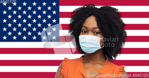 Image of african american woman in protective medical mask