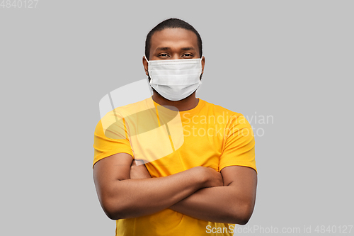 Image of african american man in protective medical mask