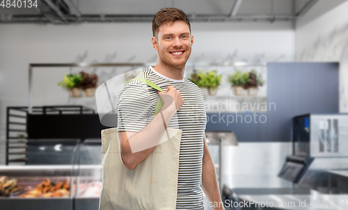 Image of man with reusable canvas bag for food shopping