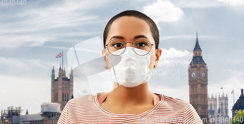 Image of young african american woman in protective mask
