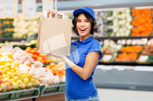 Image of delivery woman with takeaway food in paper bag