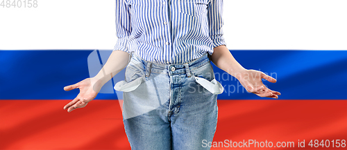 Image of close up of woman showing empty pockets