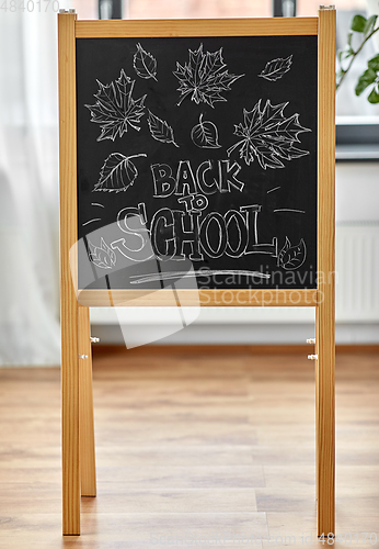 Image of back to school lettering on chalkboard at home