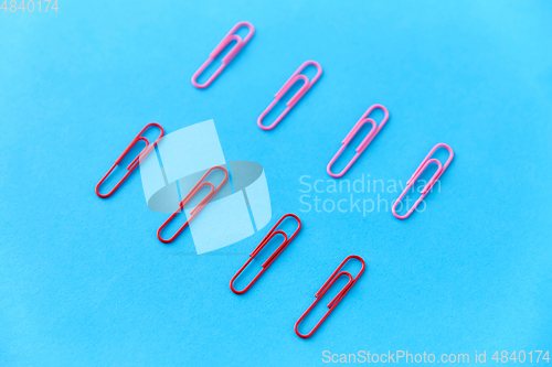 Image of office clips on blue background