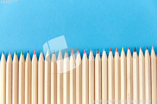 Image of coloring pencils on blue background