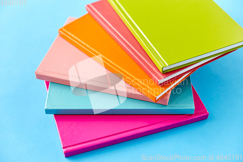 Image of notebooks or books on blue background