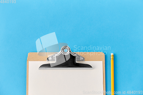 Image of clipboard with white paper sheet and pencil