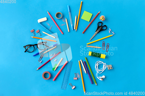 Image of stationery or school supplies on blue background