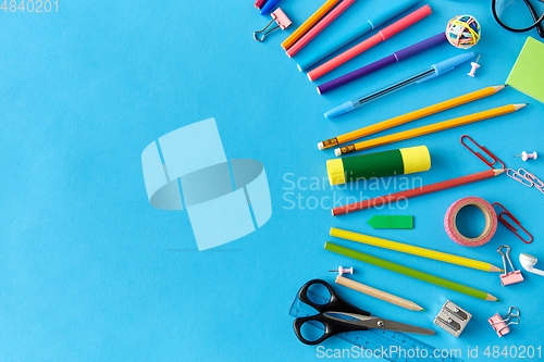 Image of stationery or school supplies on blue background