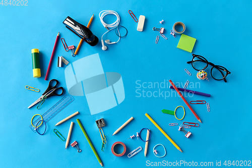 Image of stationery or school supplies on blue background