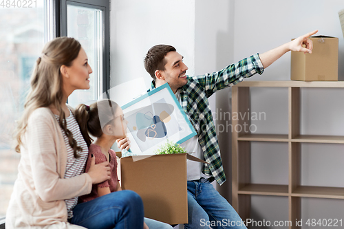 Image of happy family with child moving to new home