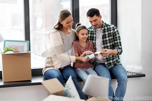 Image of happy family with color palette moving to new home