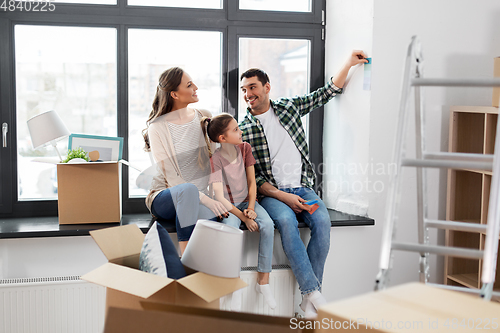 Image of happy family with color palette moving to new home