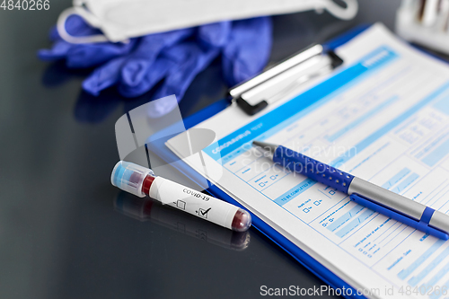 Image of beaker with coronavirus blood test at hospital