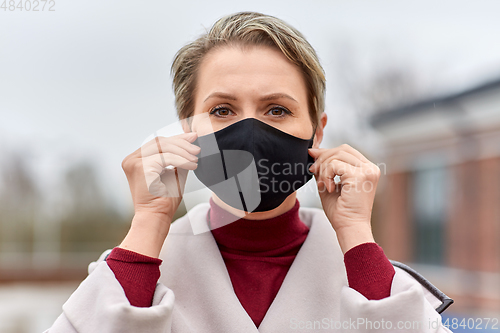 Image of woman wearing protective reusable barrier mask