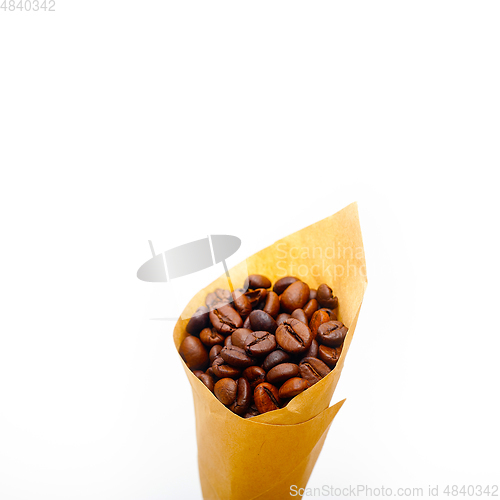 Image of espresso coffee beans on a paper cone