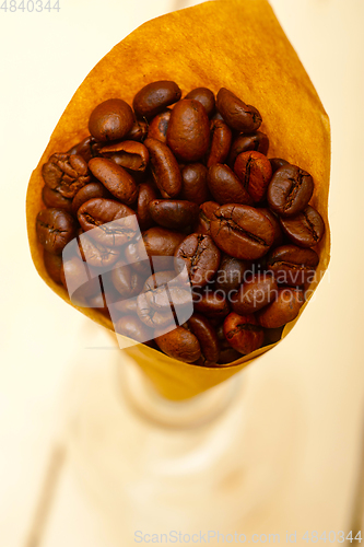 Image of espresso coffee beans on a paper cone