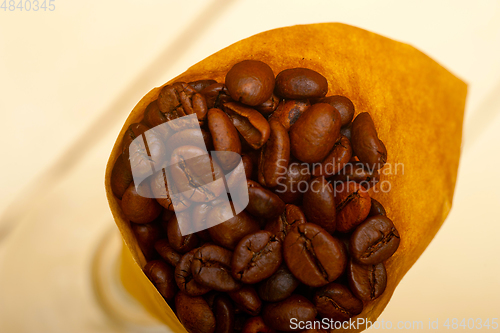 Image of espresso coffee beans on a paper cone