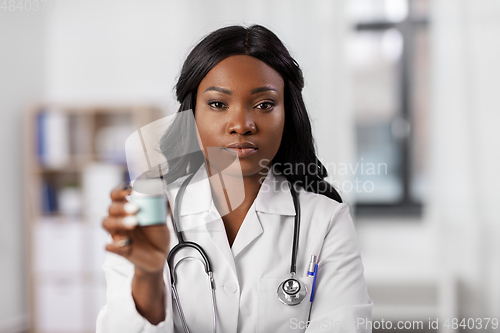 Image of african american doctor with medicine at hospital